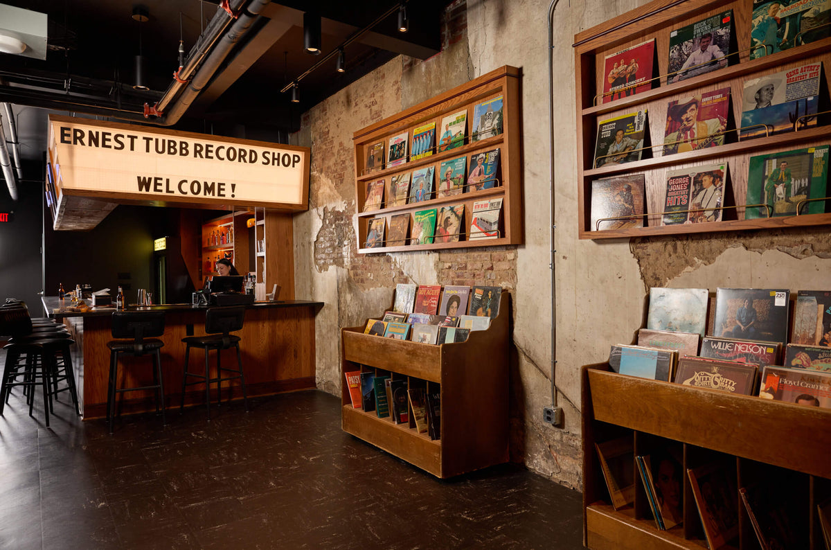 Vinyl displays and the Ernest Tubb Record Shop welcome sign inside the Broadway shop in Nashville.