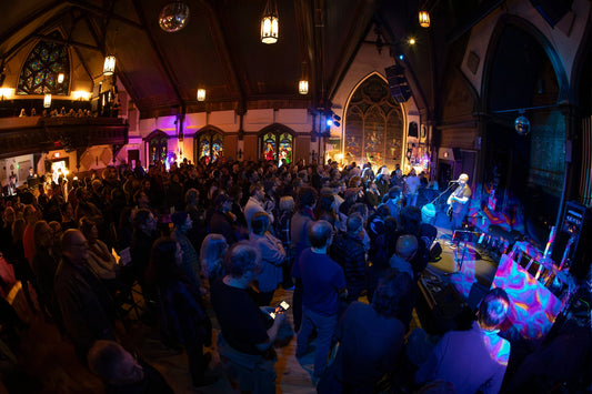 Audience and stage inside Stone Church in Brattleboro
