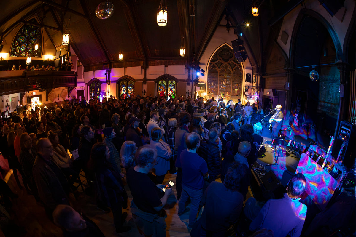 Audience and stage inside Stone Church in Brattleboro
