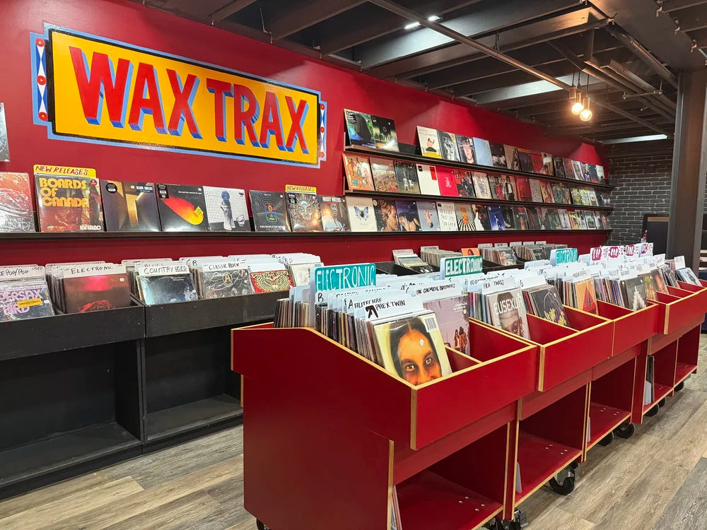 Wax Trax record bins and painted shop sign inside Stanley Marketplace in Aurora.