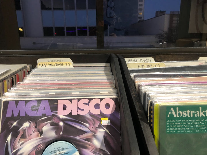 Record bins beside the window at Salt Box Records inside Hello Stranger in Little Tokyo, Los Angeles.