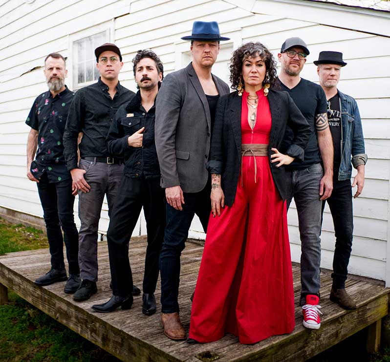 The seven members of Bywater Call in a group portrait