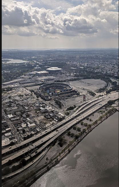 Citi Field with Arthur Ashe Stadium visible beyond it in Queens