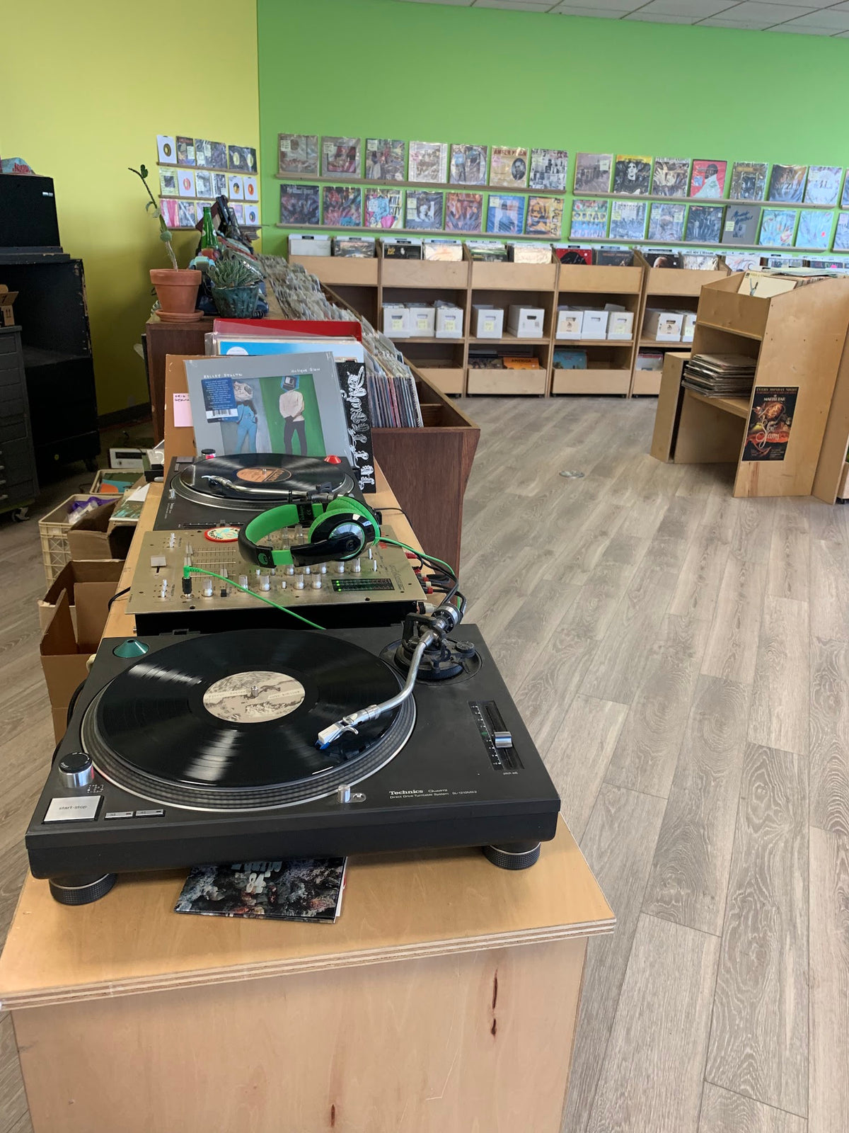 Turntables and vinyl bins inside Hello Records in Lincoln Park.