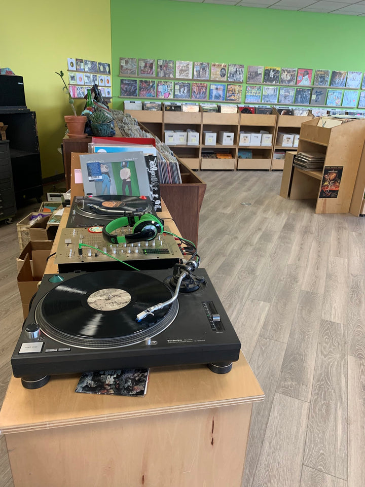 Turntables and vinyl bins inside Hello Records in Lincoln Park.