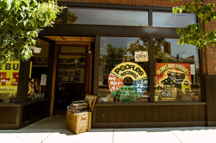 Peoples Records entrance and painted window signs on Gratiot Avenue in Detroit.