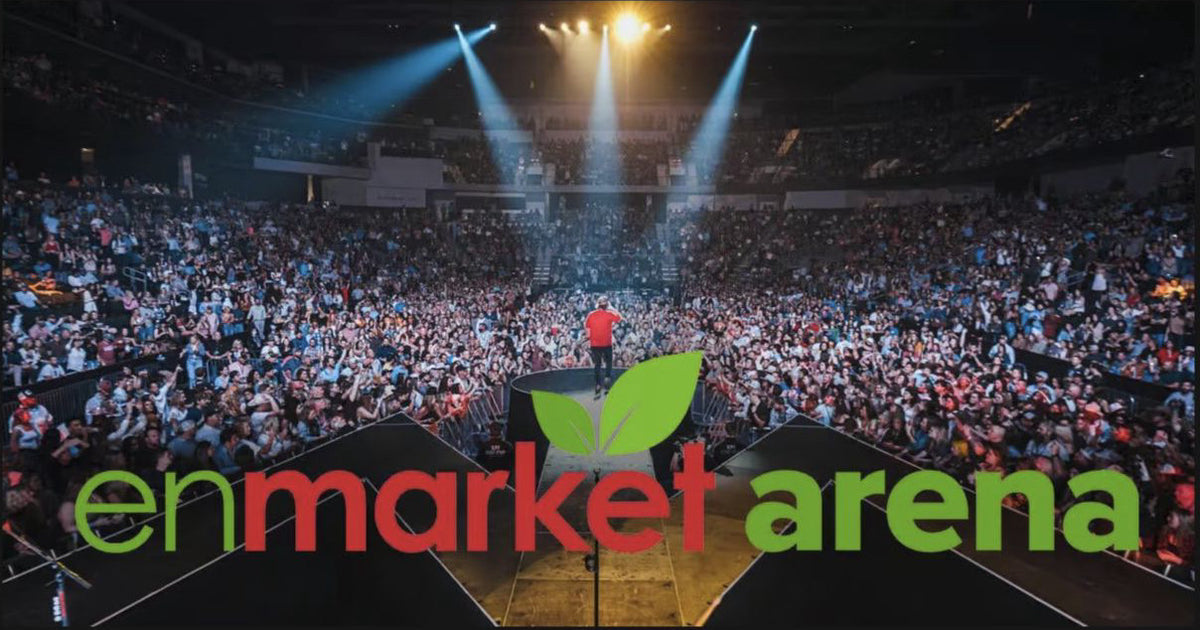 Concert crowd inside Enmarket Arena with venue branding visible