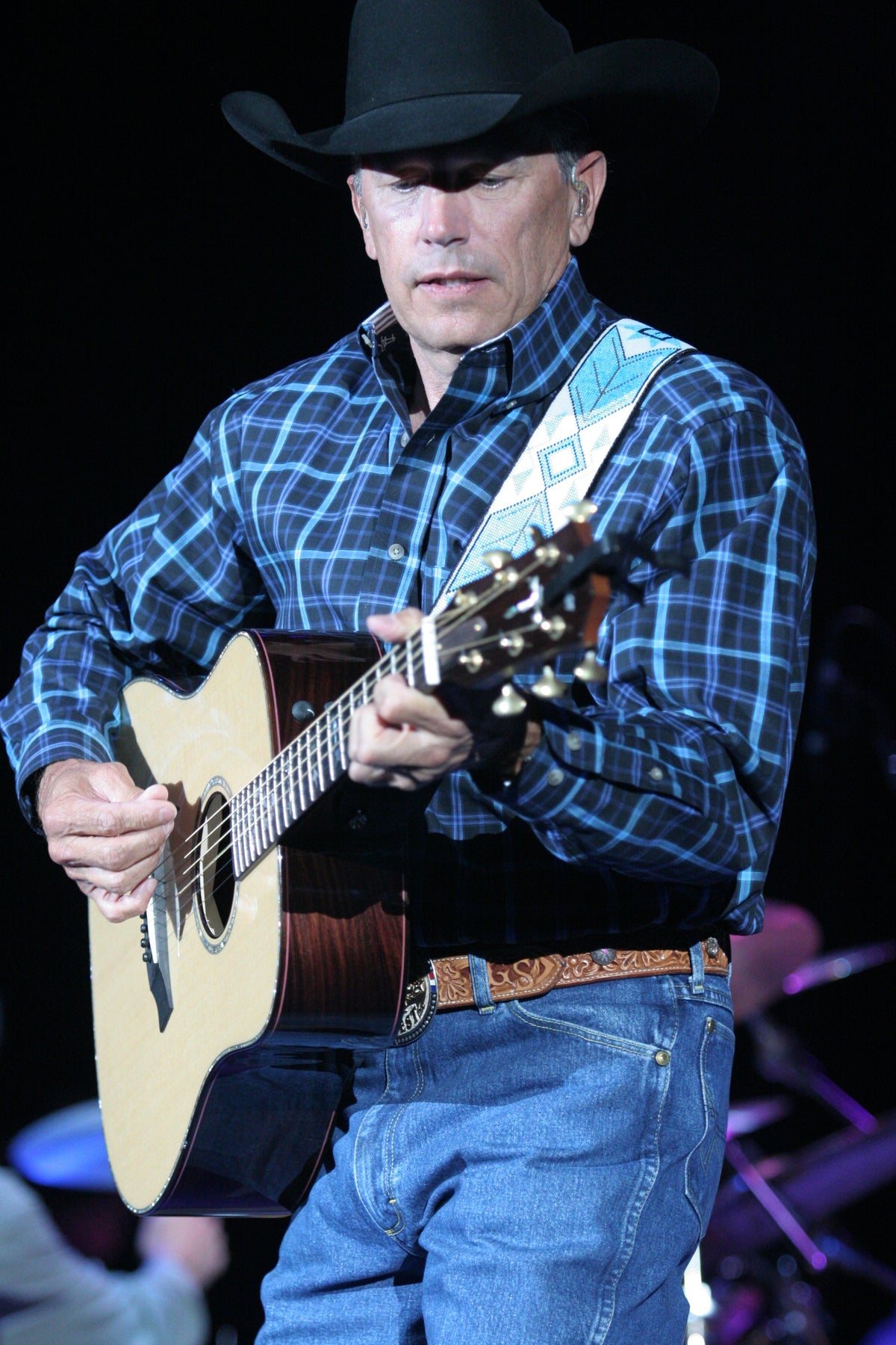 George Strait performing onstage