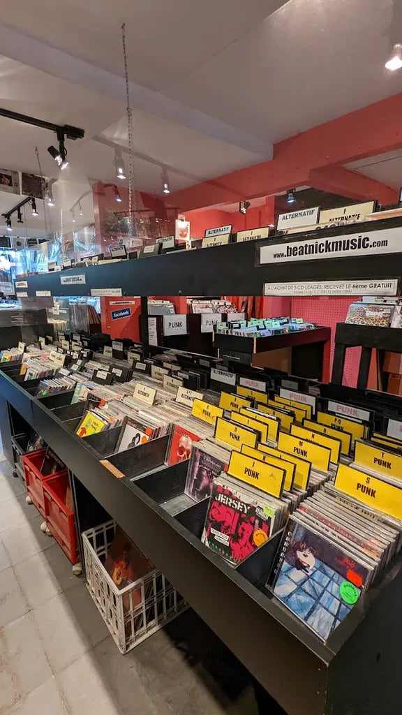 Vinyl bins and wall displays inside Disques Beatnick on rue Saint-Denis in Montréal.