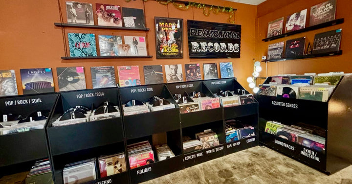 Black vinyl bins and wall displays at Elevator Vinyl inside Lykke Haus in Nashville.