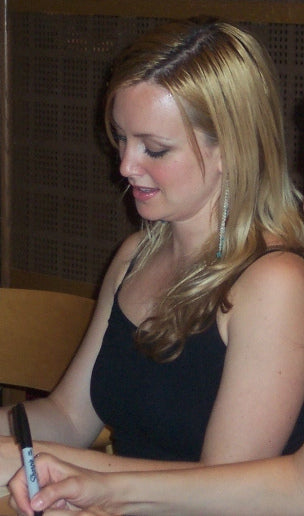 Tara MacLean signing an autograph